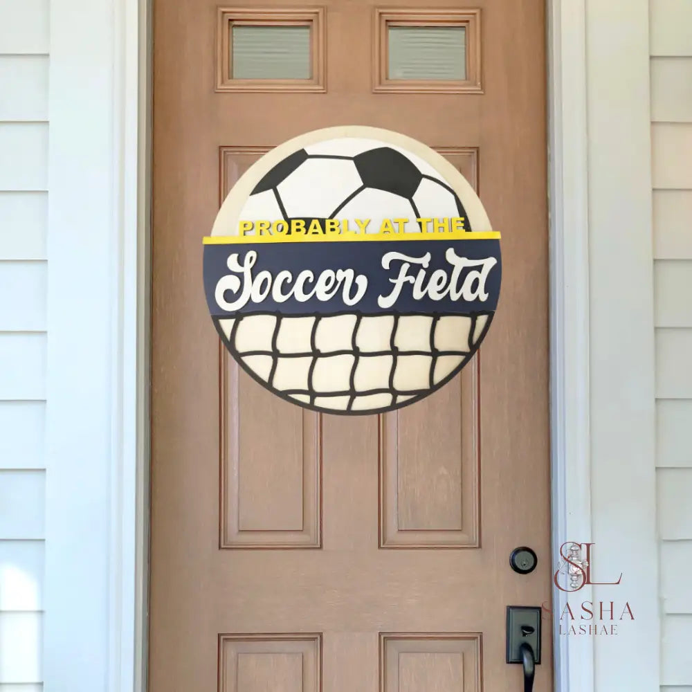 At The Soccer Field Door Sign